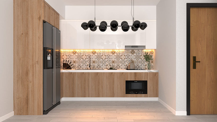 Zabudowa minimalistycznego aneksu kuchennego - szafy wraz z lod&oacute;wką i piekarnikiem. Przestrzeń udekorowano wiszącymi lampami.